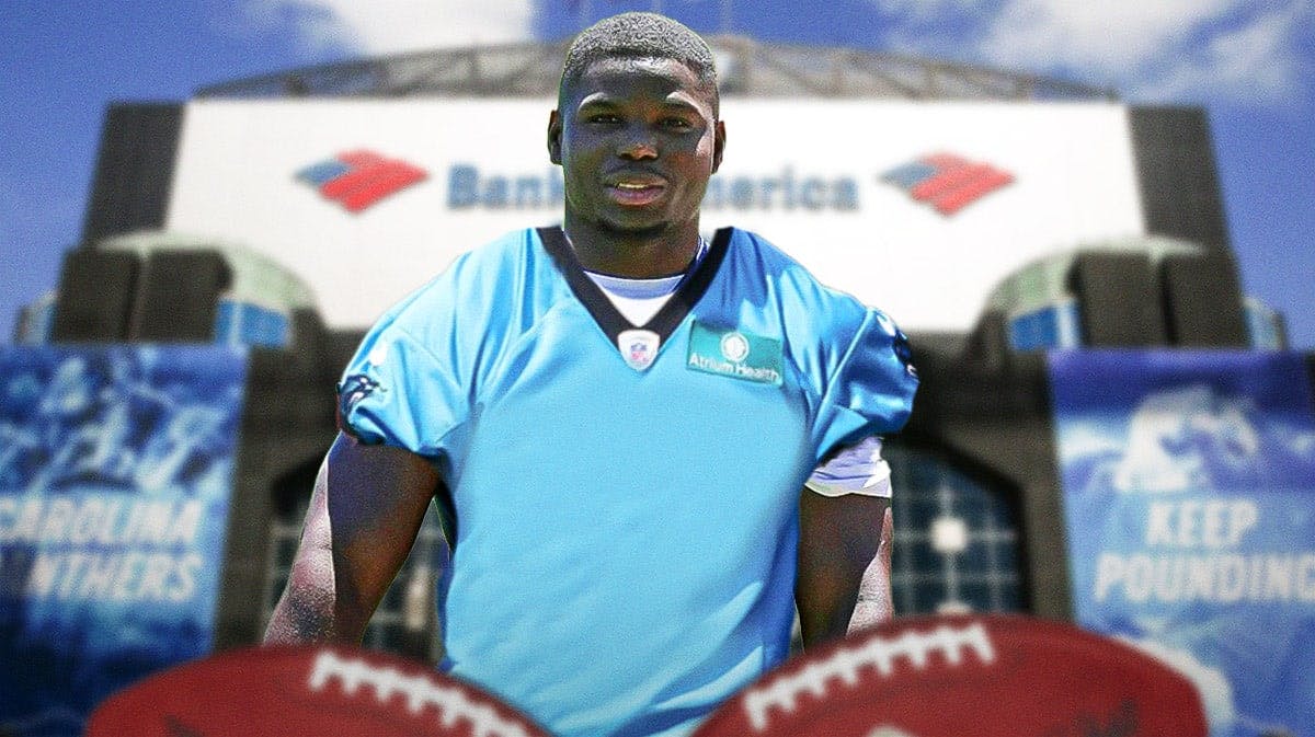 Tarik Cohen in Panthers jersey with Bank of America Stadium in background