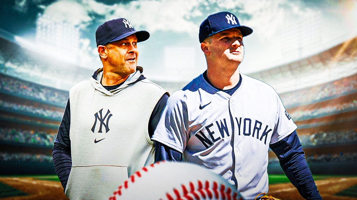 New York Yankees star Clarke Schmidt and manager Aaron Boone in front of Yankee Stadium.
