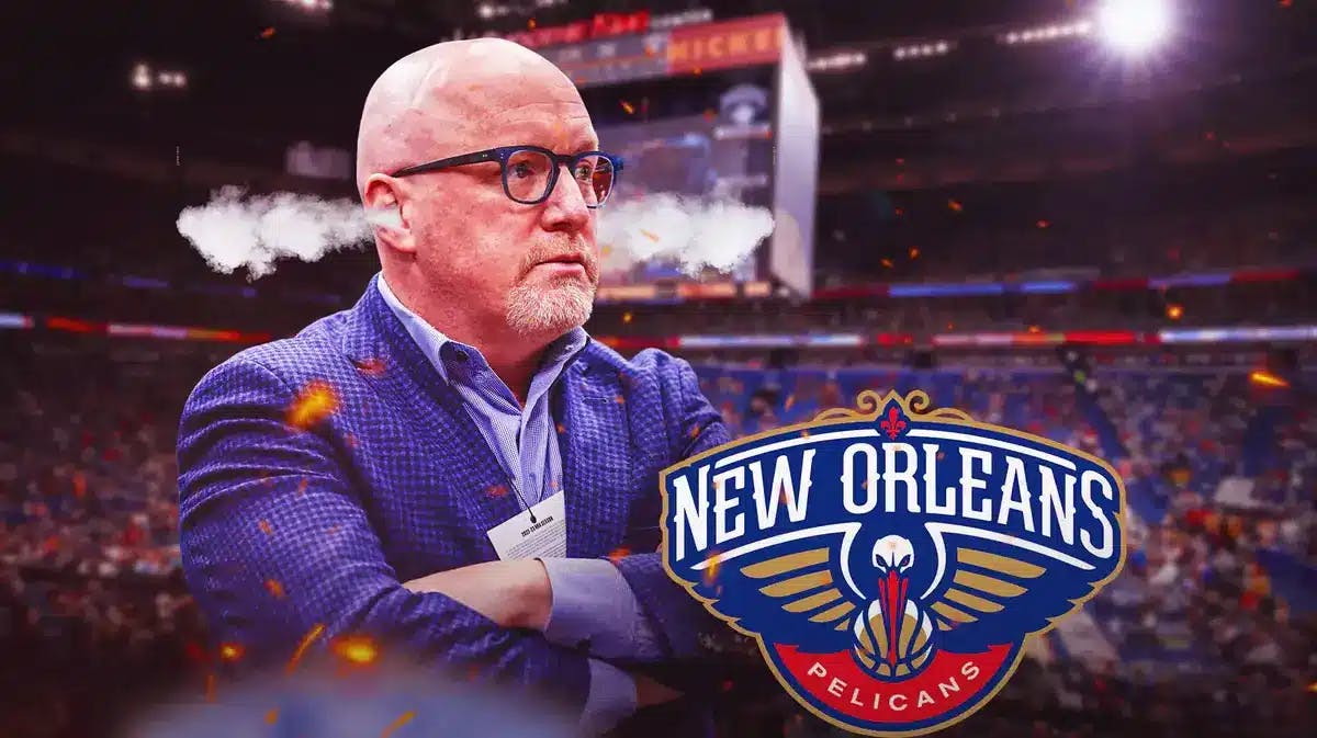 David Griffin with smoke coming out of his ears next to a Pelicans logo at Smoothie King Center