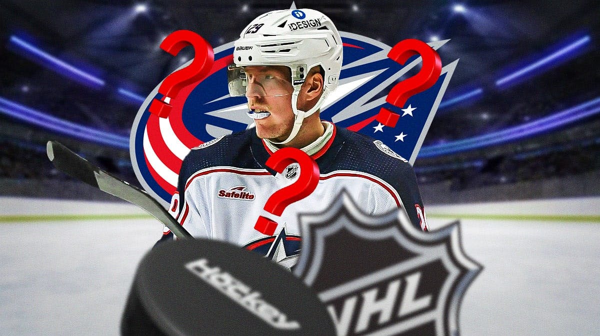 Patrik Laine in middle of image looking stern, 3-5 question marks, Columbus Blue Jackets logo, hockey rink in background