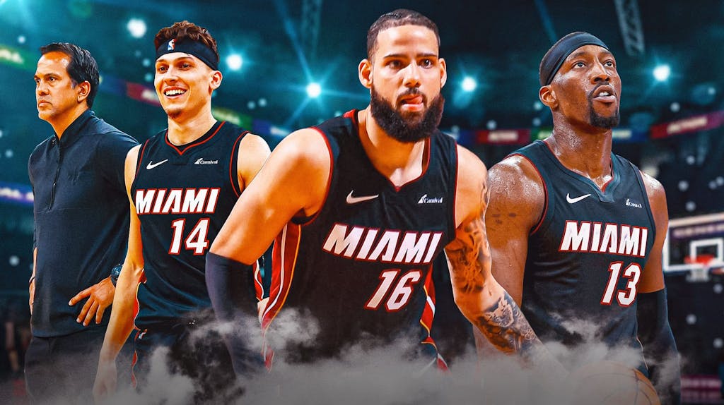 Miami Heat star Caleb Martin next to teammates Tyler Herro, Bam Adebayo, and head coach Erik Spoelstra.