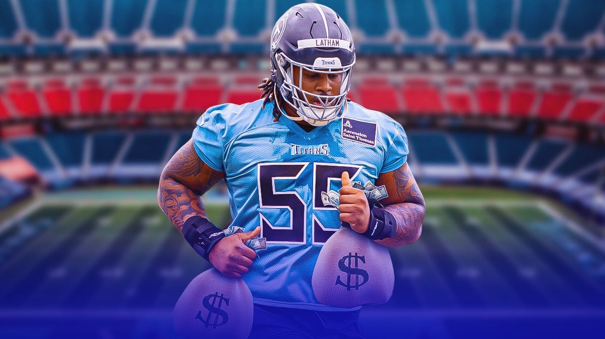 JC Latham holds a bag of money in Tennessee Titans uniform